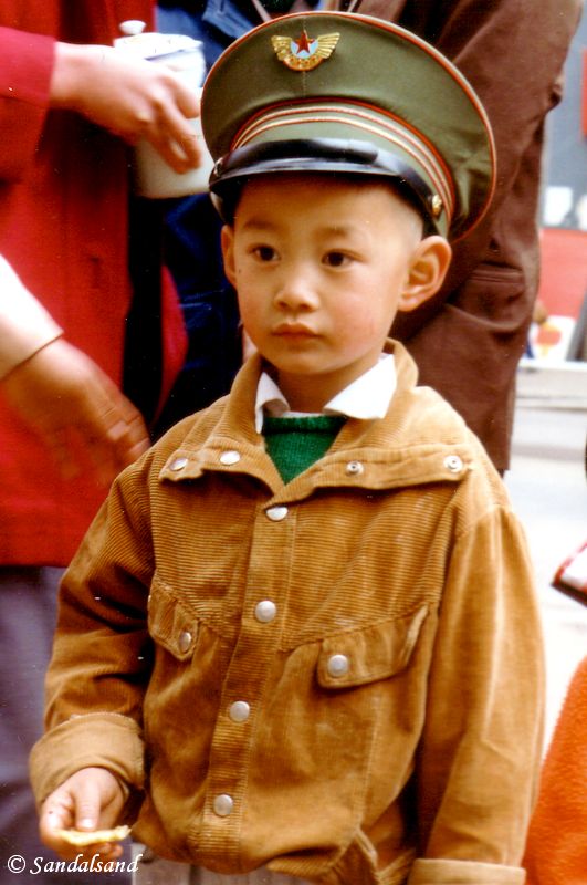 Military hats were popular among young boys. China - Kunming
