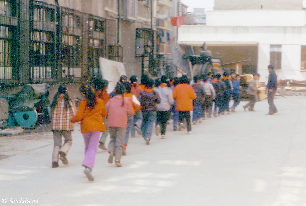 School-children marching in Shanghai China - Shanghai