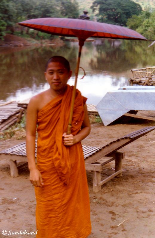 Thailand - Young Buddhist monk with umbrella in Mae Sai Thailand - Mae Sai