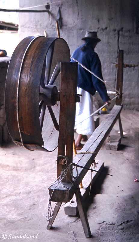 Ecuador - Spinning wool on a wheel the traditional way near Otavalo Ecuador - Spinning wool on a wheel the traditional way near Otavalo